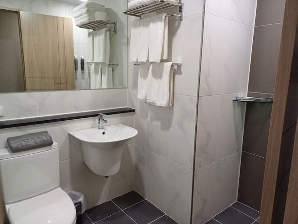 Imagen de la habitación del Hotel The Triny Urban Suites. Foto 16