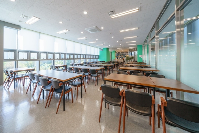 Imagen del bar/restaurante del Hotel The Triny Urban Suites. Foto 4