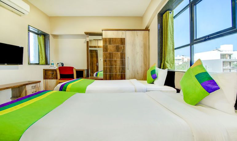 Imagen de la habitación del Hotel The Tripti. Foto 3