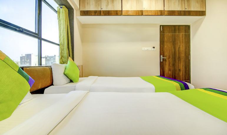 Imagen de la habitación del Hotel The Tripti. Foto 9