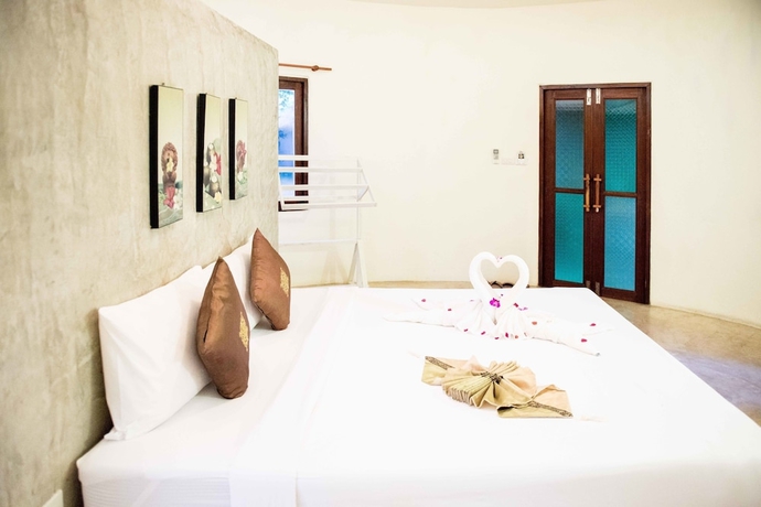 Imagen de la habitación del Hotel The Tropical Beach Resort. Foto 9
