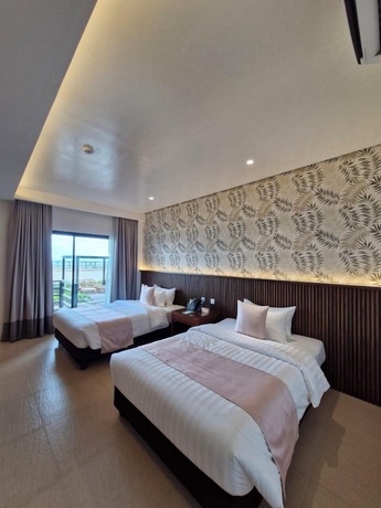 Imagen de la habitación del Hotel The Tropics at MacArthur Park Resort and Convention Center. Foto 1