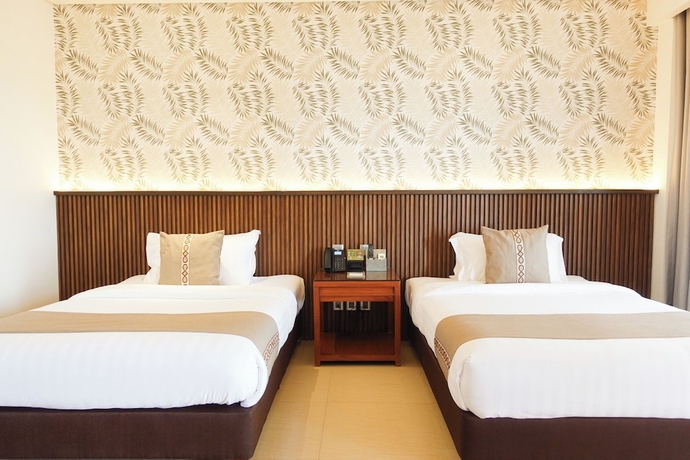 Imagen de la habitación del Hotel The Tropics at MacArthur Park Resort and Convention Center. Foto 2