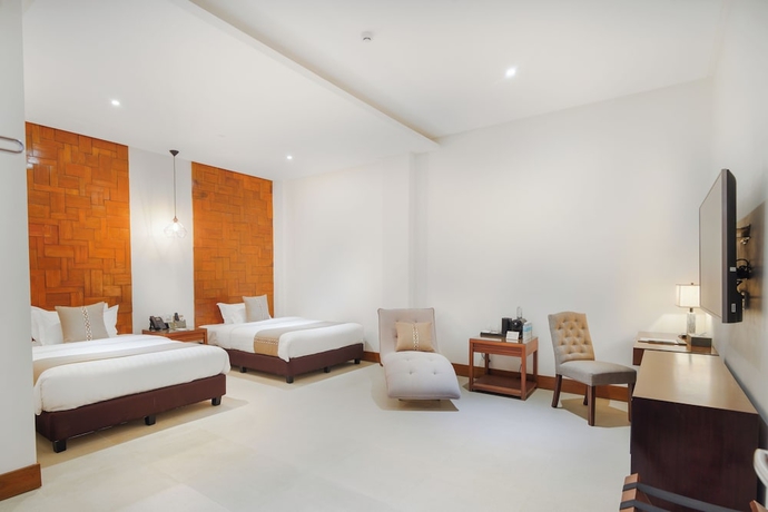 Imagen de la habitación del Hotel The Tropics at MacArthur Park Resort and Convention Center. Foto 6