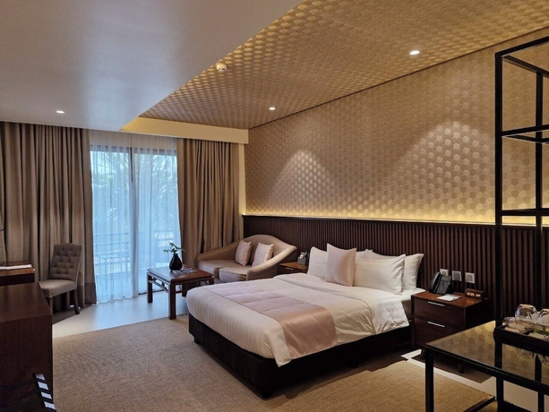Imagen de la habitación del Hotel The Tropics at MacArthur Park Resort and Convention Center. Foto 7