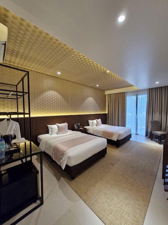 Imagen de la habitación del Hotel The Tropics at MacArthur Park Resort and Convention Center. Foto 9