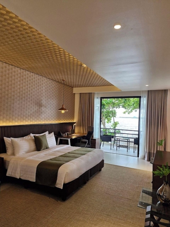 Imagen de la habitación del Hotel The Tropics at MacArthur Park Resort and Convention Center. Foto 11