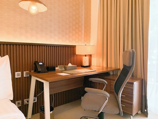 Imagen de la habitación del Hotel The Tropics at MacArthur Park Resort and Convention Center. Foto 12