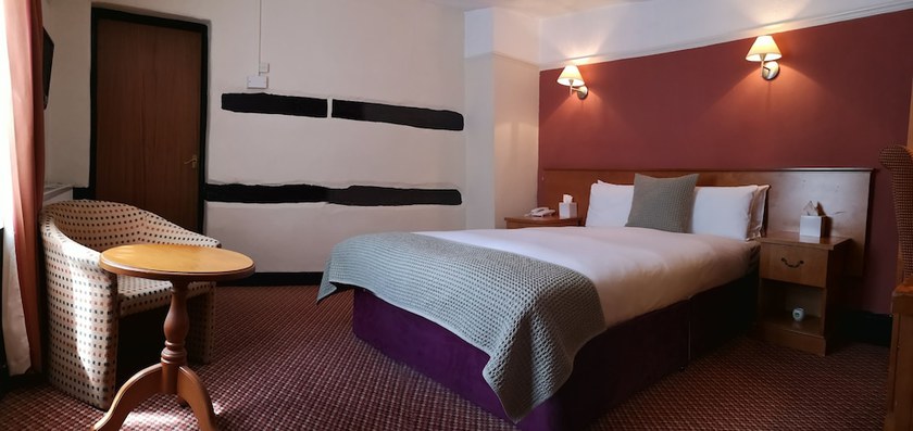 Imagen de la habitación del Hotel The Tudor. Foto 10