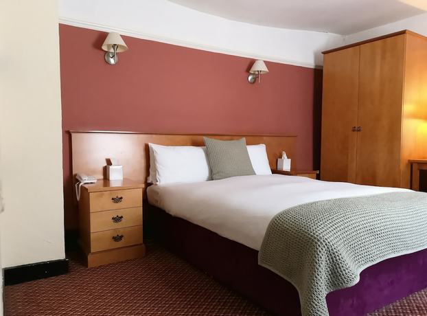 Imagen de la habitación del Hotel The Tudor. Foto 16