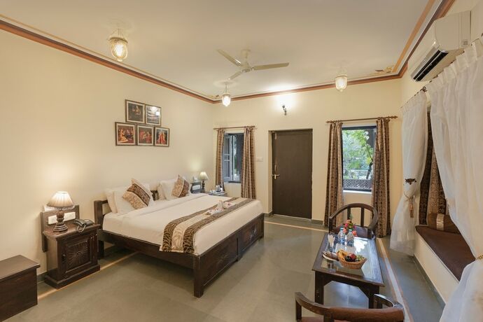 Imagen de la habitación del Hotel The Udai Bagh. Foto 19