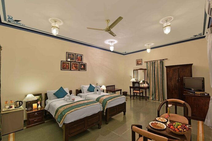 Imagen de la habitación del Hotel The Udai Bagh. Foto 20