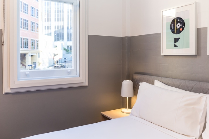 Imagen de la habitación del Hotel The Ultimo. Foto 4