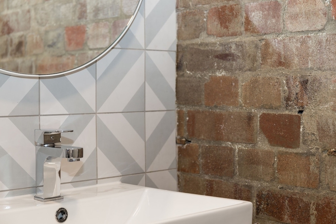 Imagen de la habitación del Hotel The Ultimo. Foto 9