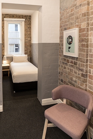 Imagen de la habitación del Hotel The Ultimo. Foto 10