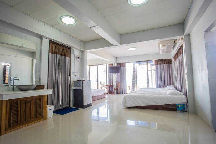 Imagen de la habitación del Hotel The Uncle Beach Resort. Foto 16
