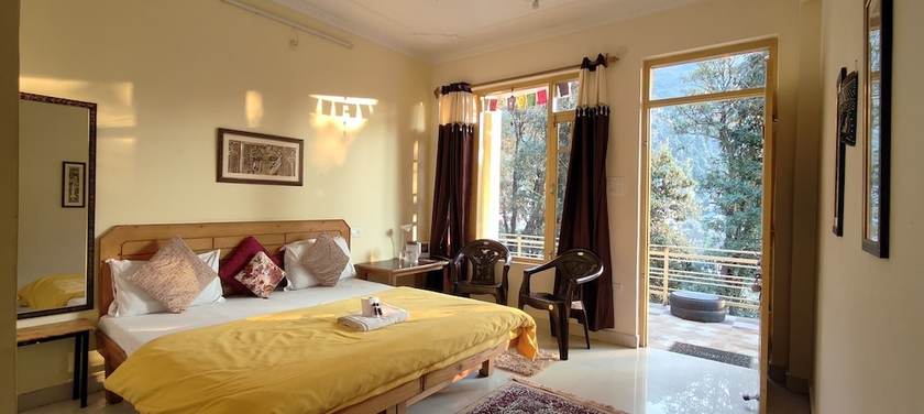 Imagen de la habitación del Hotel The Unmad. Foto 2