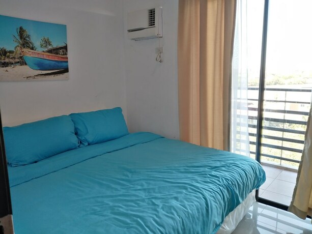 Imagen de la habitación del Hotel The Uptown Place. Foto 22