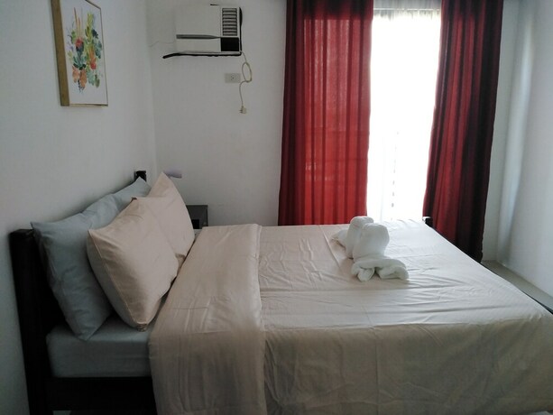 Imagen de la habitación del Hotel The Uptown Place. Foto 23