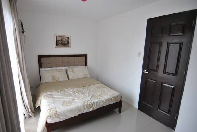 Imagen de la habitación del Hotel The Uptown Place. Foto 29