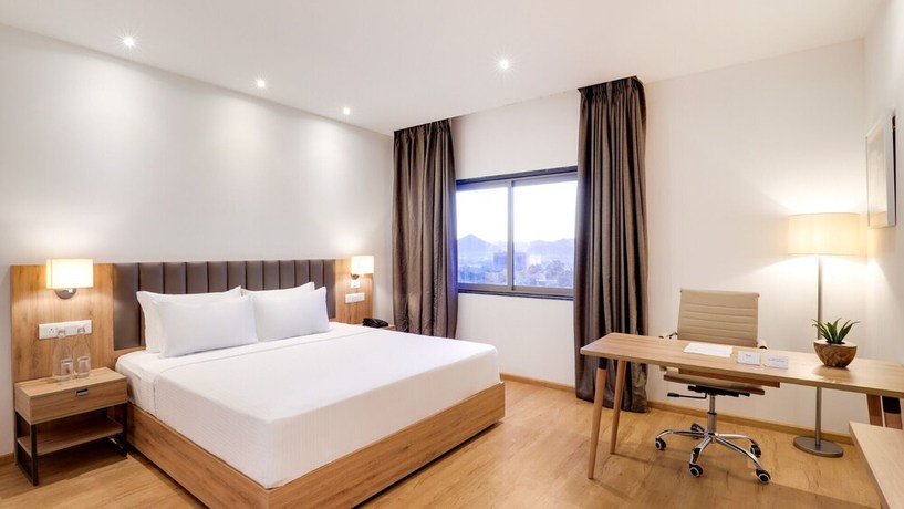 Imagen de la habitación del Hotel The Urban Suites. Foto 7