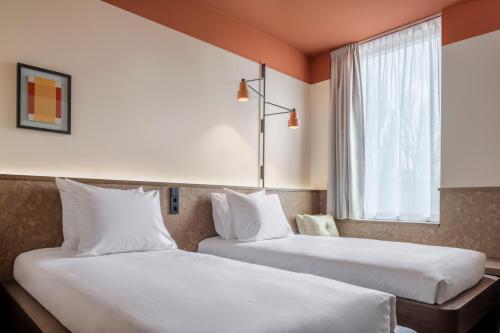 Imagen de la habitación del Hotel The Usual Rotterdam. Foto 3