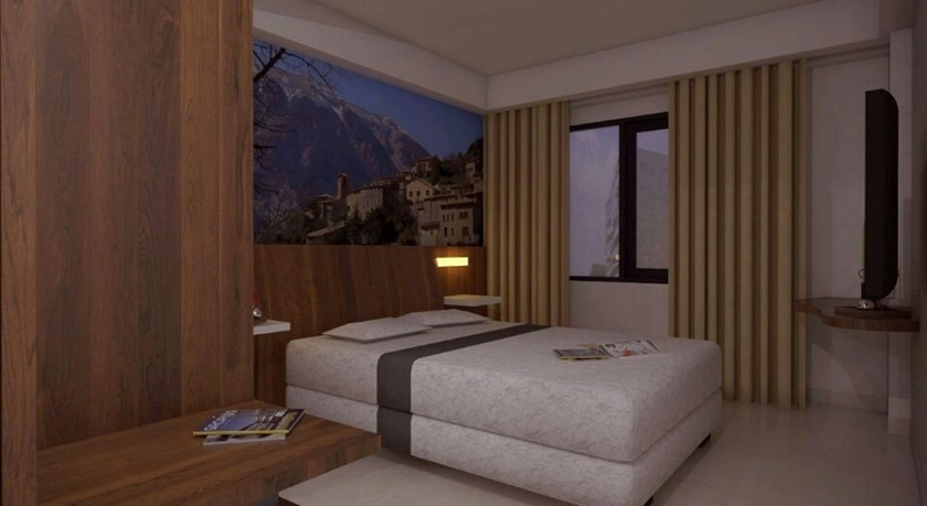 Imagen de la habitación del Hotel The Vasini. Foto 8