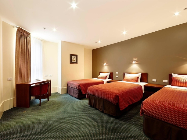 Imagen de la habitación del Hotel The Victoria Melbourne. Foto 10