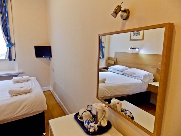 Imagen de la habitación del Hotel The Victorian House. Foto 6