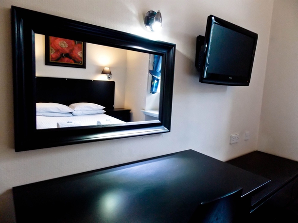 Imagen de la habitación del Hotel The Victorian House. Foto 9