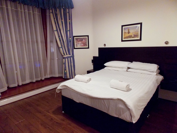 Imagen de la habitación del Hotel The Victorian House. Foto 11