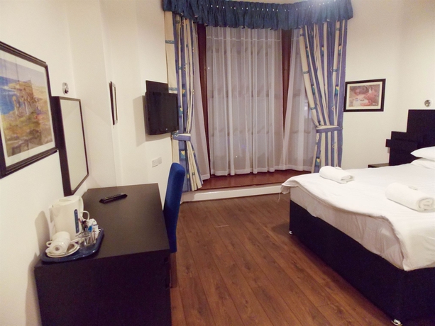 Imagen de la habitación del Hotel The Victorian House. Foto 12