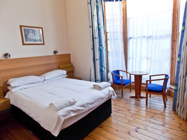 Imagen de la habitación del Hotel The Victorian House. Foto 13