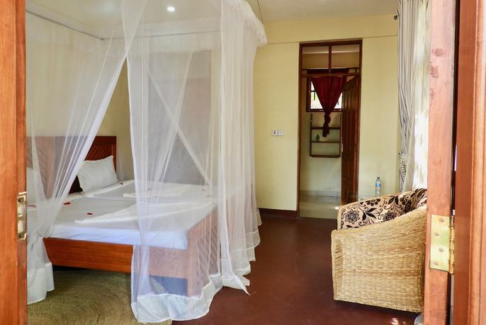 Imagen de la habitación del Hotel The Vijiji Center Lodge and Safari. Foto 14