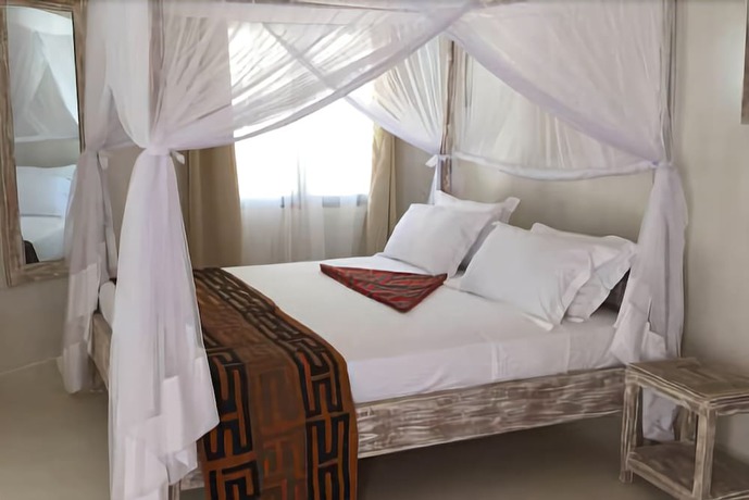 Imagen de la habitación del Hotel The Villa Luxury Suites Hotel. Foto 11