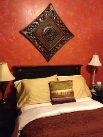 Imagen de la habitación del Hotel The Villa Toscana. Foto 2
