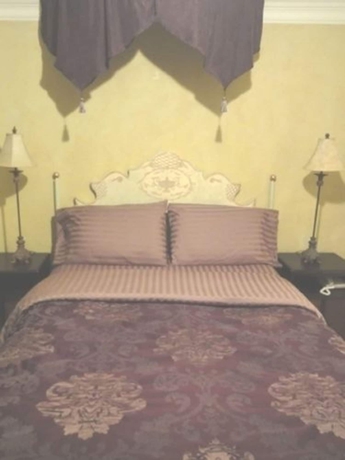 Imagen de la habitación del Hotel The Villa Toscana. Foto 6
