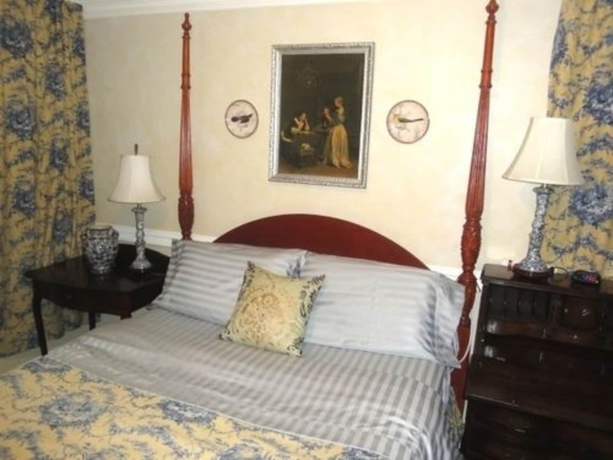 Imagen de la habitación del Hotel The Villa Toscana. Foto 9