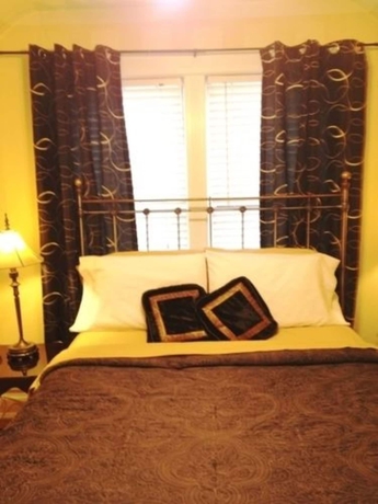 Imagen de la habitación del Hotel The Villa Toscana. Foto 18