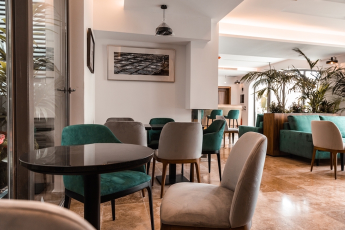 Imagen del bar/restaurante del Hotel The Village Boutique and Spa. Foto 2