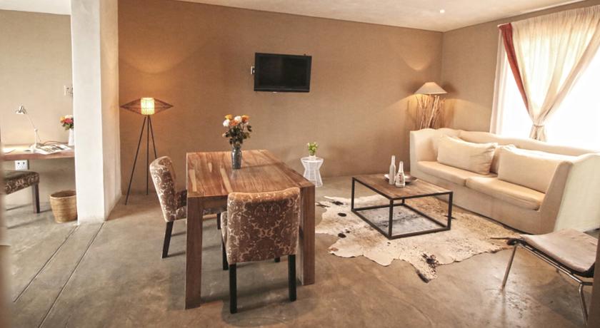Imagen de la habitación del Hotel The Village Courtyard Suites. Foto 3