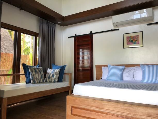 Imagen de la habitación del Hotel The Village Siargao. Foto 24