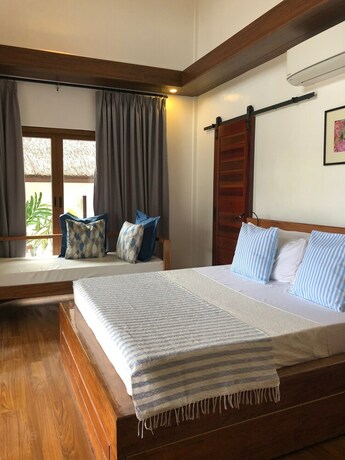 Imagen de la habitación del Hotel The Village Siargao. Foto 25