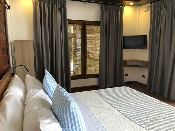 Imagen de la habitación del Hotel The Village Siargao. Foto 26