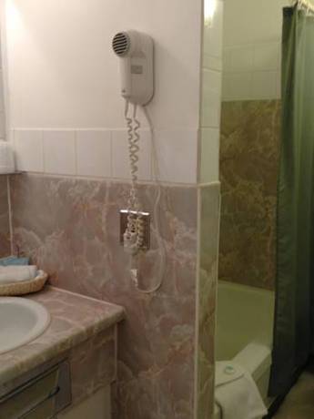 Imagen de la habitación del Hotel The Villager Inn. Foto 14