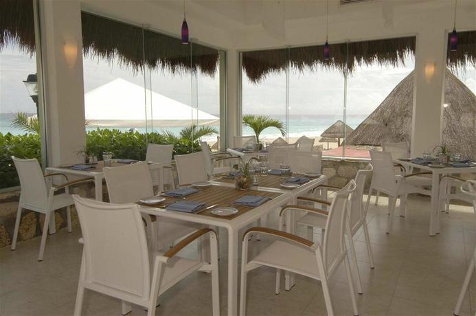 Imagen del bar/restaurante del Hotel The Villas Cancun by Grand Park Royal. Foto 2