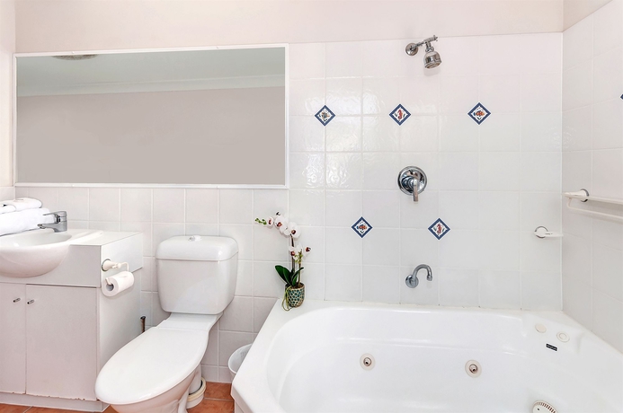 Imagen de la habitación del Hotel The Villas Palm Cove. Foto 5