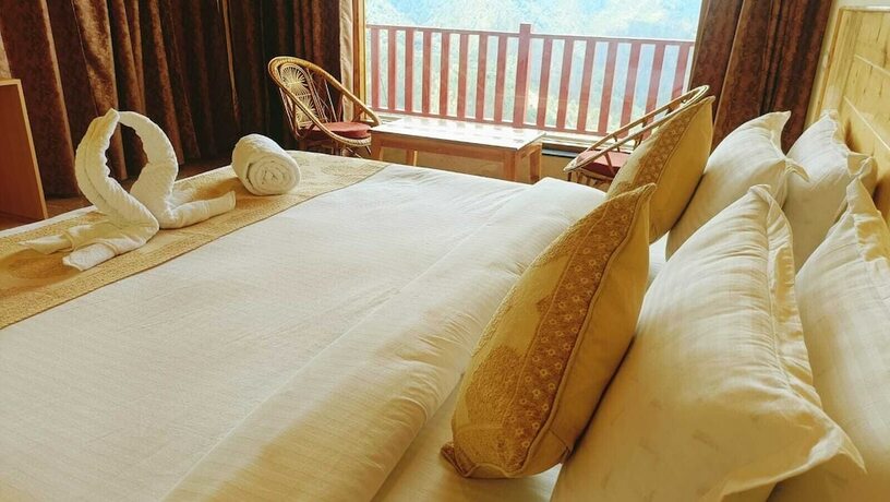 Imagen de la habitación del Hotel The Vintage Hill Village. Foto 18