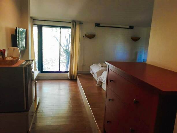 Imagen de la habitación del Hotel The Waterfall. Foto 9