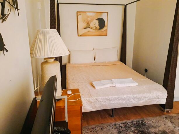 Imagen de la habitación del Hotel The Waterfall. Foto 19